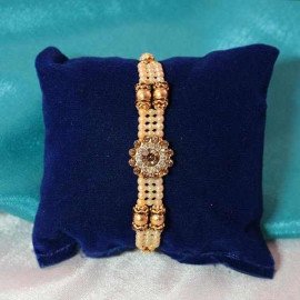 Attractive stone-studded Rakhi to shower your brother with love