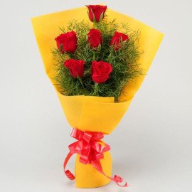 Red Roses In Yellow Paper
